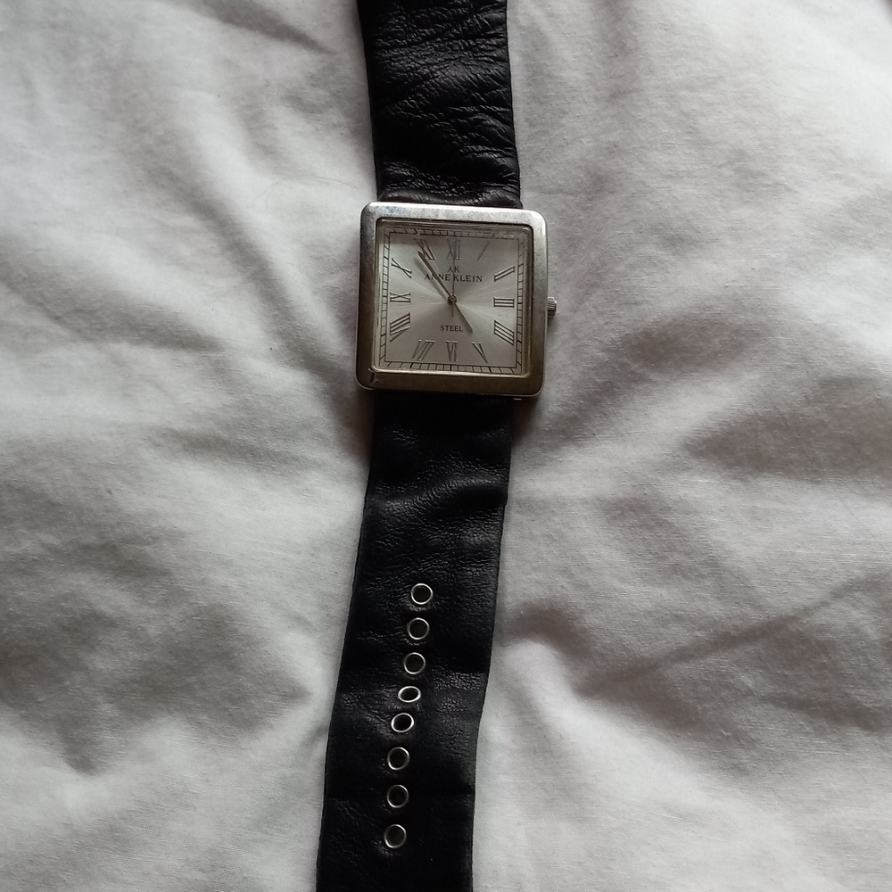Anne Klien stainless steel leather band ladies watch.